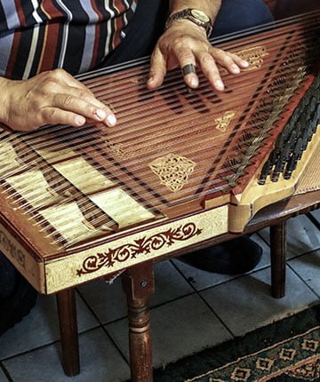 Man playing qanun